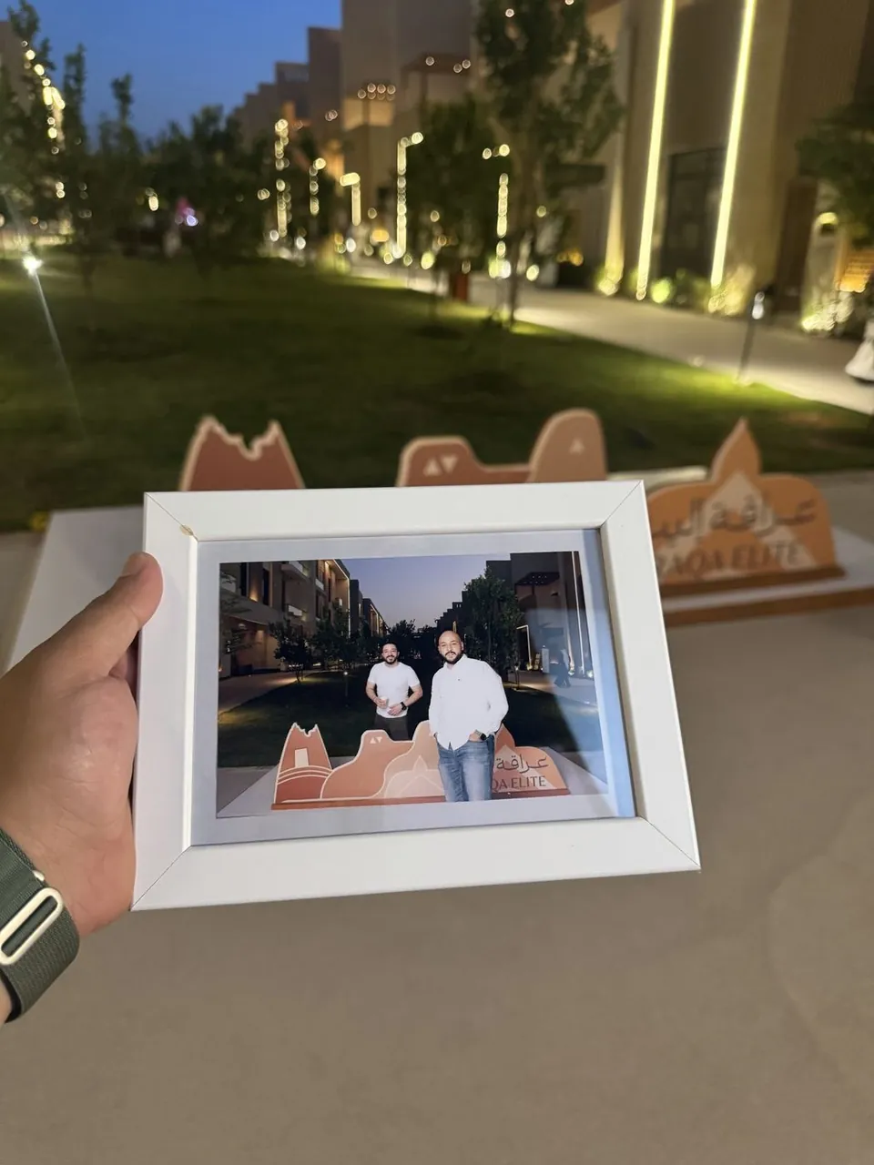 Framed Tower booth print at an Araqa community event