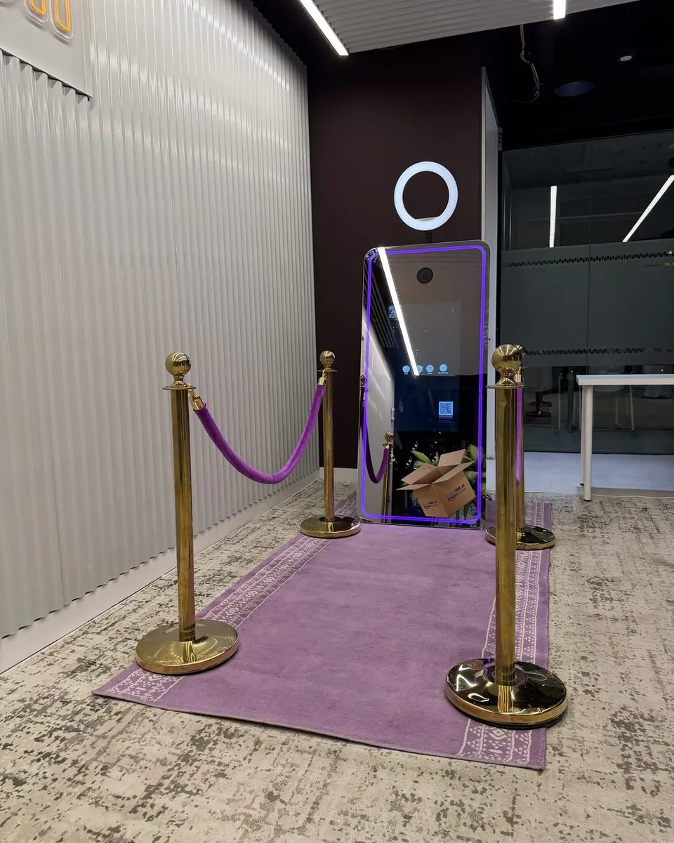 Magic Mirror photo booth on a purple carpet